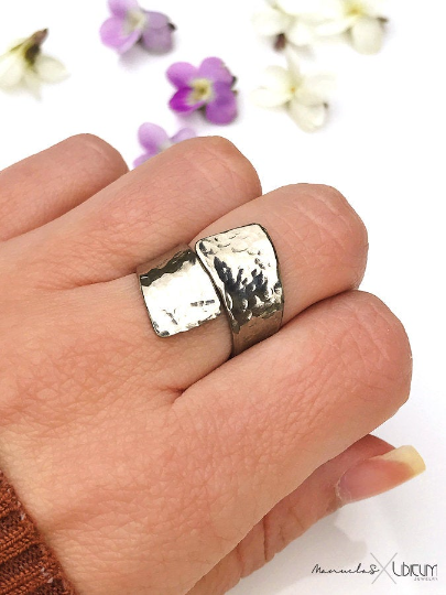 Hammered titanium ring with a textured, handcrafted finish. Lightweight, durable, hypoallergenic, and tarnish-resistant