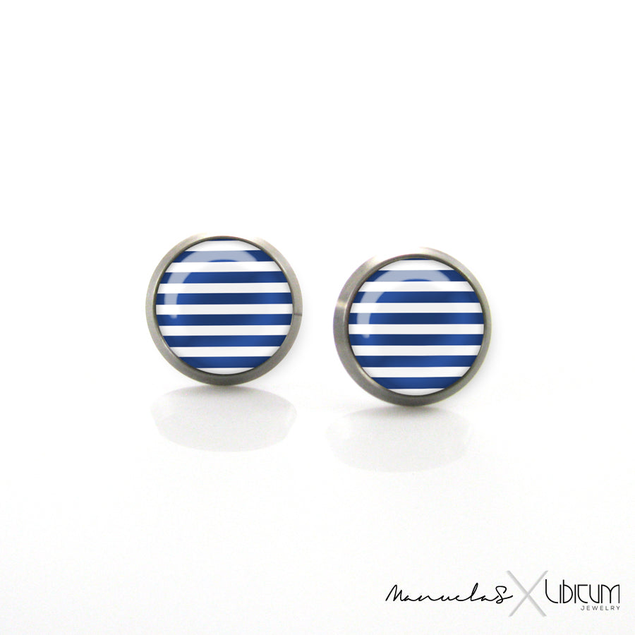 Navy-style titanium earrings featuring four summer-inspired patterns: white polka dots, blue polka dots, blue and white stripes, and a white anchor on a blue background. Available in 8mm and 10mm sizes.