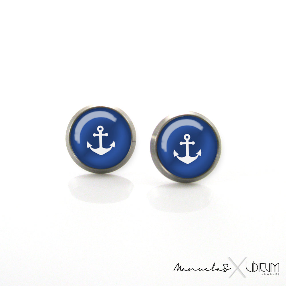 Navy-style titanium earrings featuring four summer-inspired patterns: white polka dots, blue polka dots, blue and white stripes, and a white anchor on a blue background. Available in 8mm and 10mm sizes.