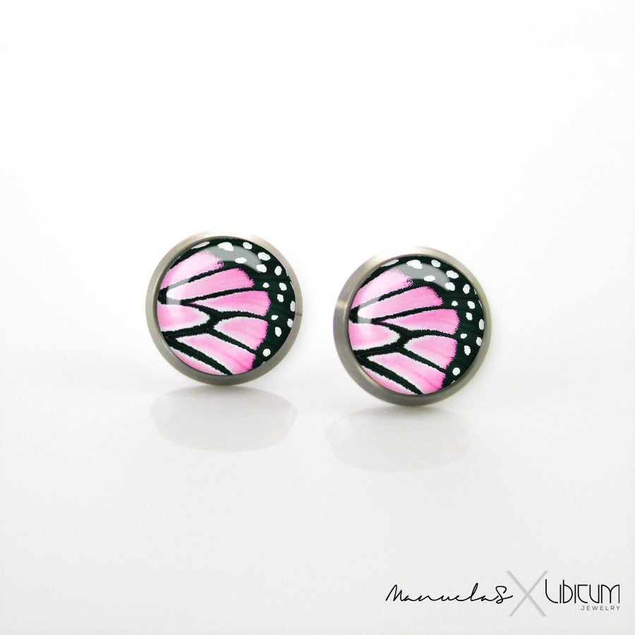 Pink and black butterfly wing titanium earrings, available in 8mm and 10mm sizes. Hypoallergenic, lightweight, and safe for sensitive ears.