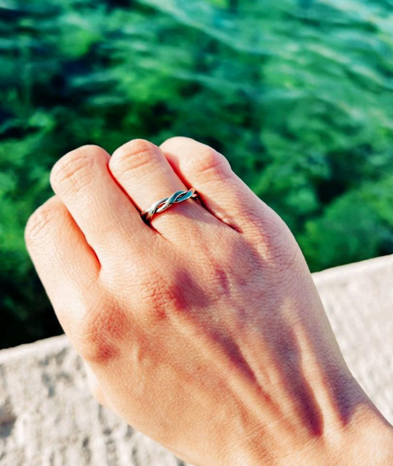 Pure titanium braided ring with intricate woven design. Lightweight, durable, hypoallergenic, and tarnish-resistant, suitable for sensitive skin