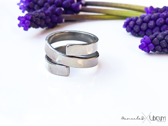 Pure titanium wrap-around ring with sleek, open-ended design. Lightweight, durable, hypoallergenic, and tarnish-resistant