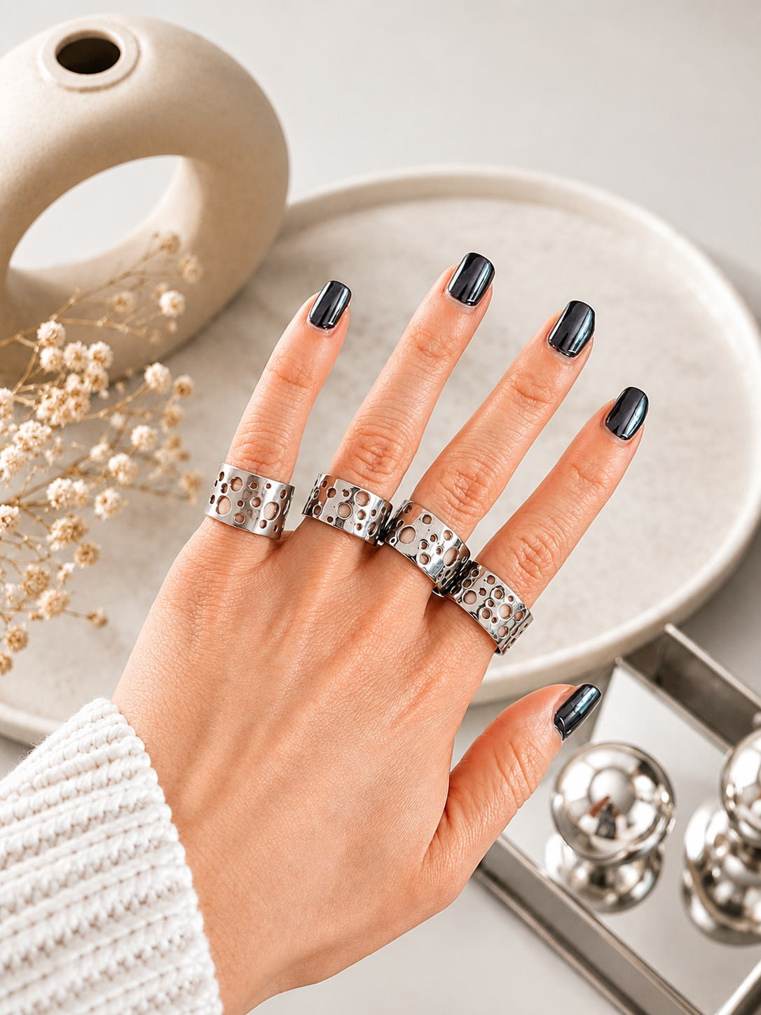 Adjustable titanium ring for women with openwork circle design worn on hand