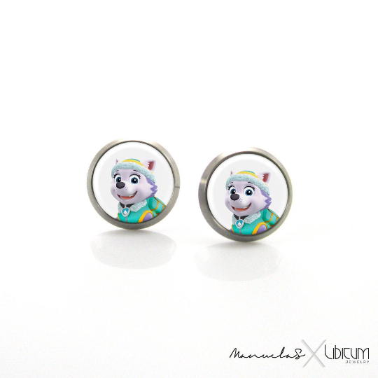 Titanium Children's Earrings featuring Everest from Paw Patrol, available in 8mm and 10mm sizes. Crafted from hypoallergenic titanium for safe and stylish wear. Adorned with a playful image of Everest, adding charm and whimsy to your child's accessory collection. Ideal for young fashion enthusiasts seeking comfort and adventure in every detail."