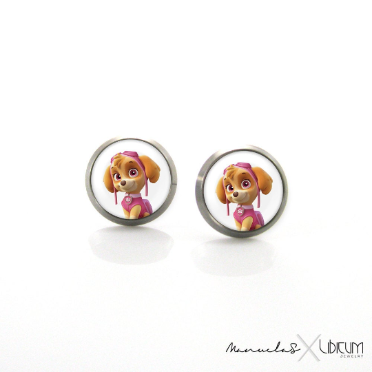 Titanium Children's Earrings featuring Skye from Paw Patrol, available in 8mm and 10mm sizes. Crafted from hypoallergenic titanium for safe and stylish wear. Adorned with a playful image of Skye, adding charm and whimsy to your child's accessory collection. Ideal for young fashion enthusiasts seeking comfort and adventure in every detail."