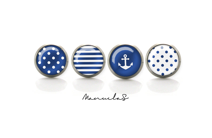 Navy-style titanium earrings featuring four summer-inspired patterns: white polka dots, blue polka dots, blue and white stripes, and a white anchor on a blue background. Available in 8mm and 10mm sizes.