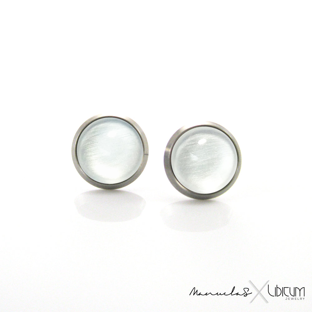 Pearl white titanium earrings for adults, available in 8mm and 10mm sizes. Hypoallergenic, lightweight, and durable for sensitive ears.