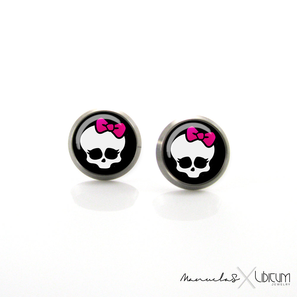 Alt text: Children's titanium earrings featuring a Monster High character, available in 8mm and 10mm sizes. Hypoallergenic and designed for sensitive ears.